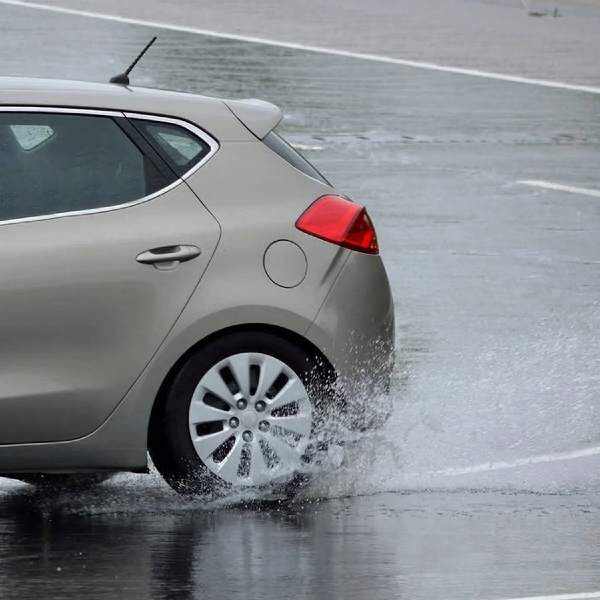 close up tyre tread depth wet road